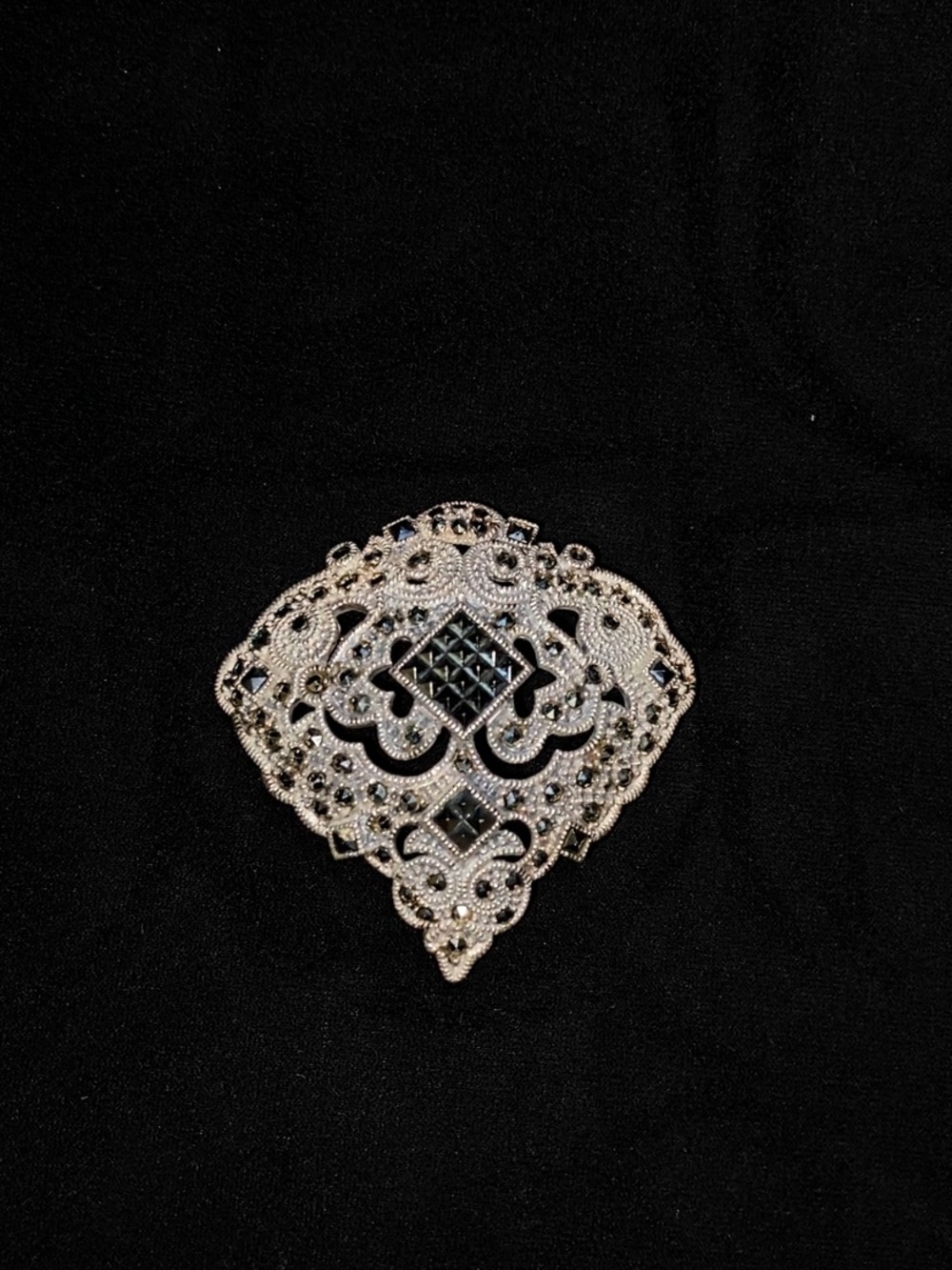 Silver-Tone Filigree Brooch with Black Accents